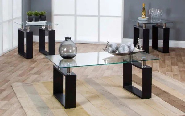 A coffee table set with a wooden base, metal support, and a transparent glass top