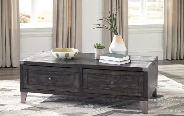 a wooden occasional table with metallic hardware, legs, and accent detailing on the tabletop corners