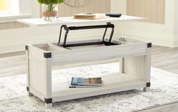 A coffee table with a lifted top to create a temporary workspace