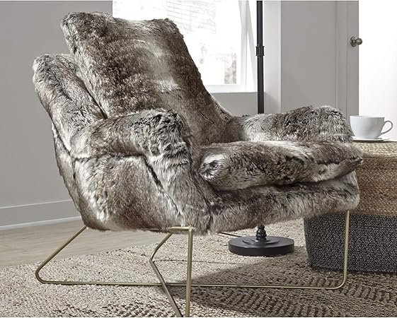 Modern accent chair with faux fur upholstery and golden metallic frame
