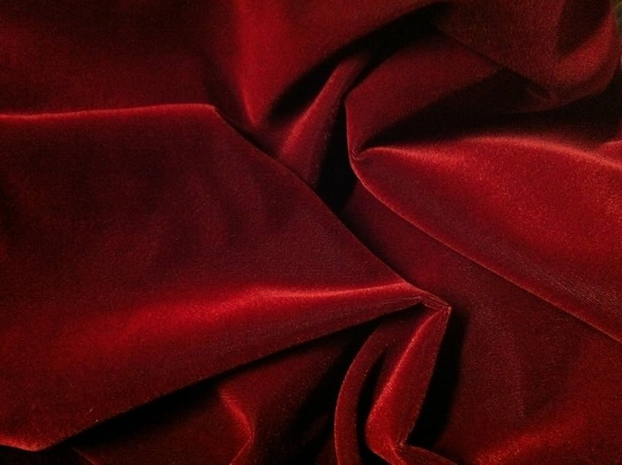Smooth red velvet fabric close up